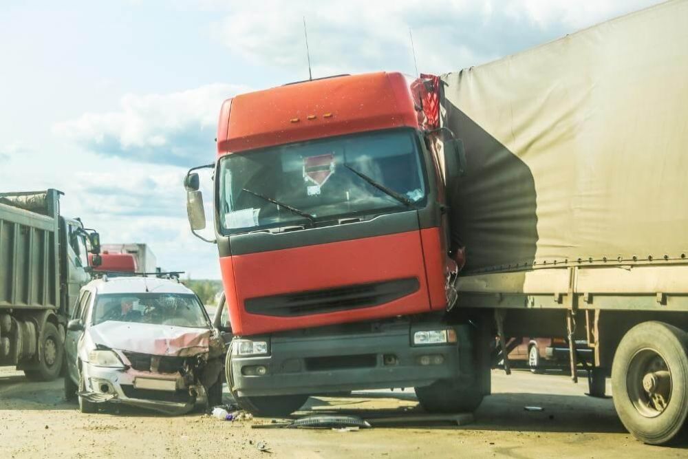 Red truck next to a dump truck